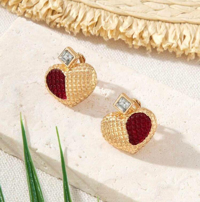 Clip on 1" gold textured heart earrings w/red half stone