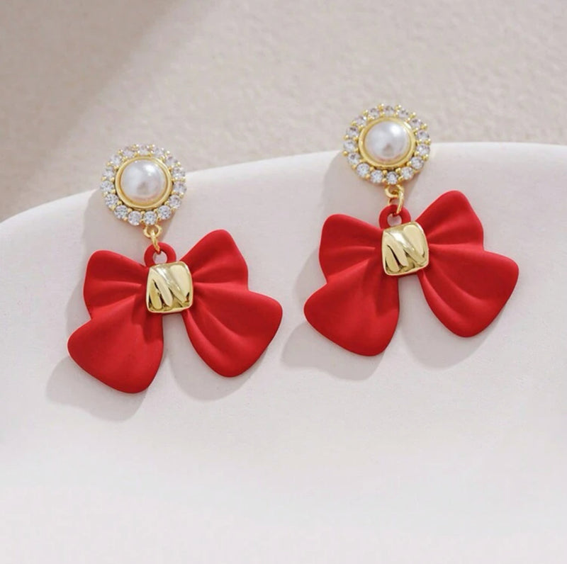Comfort fit 1 1/4" gold and red bow dangle earrings w/clear stones & pearl