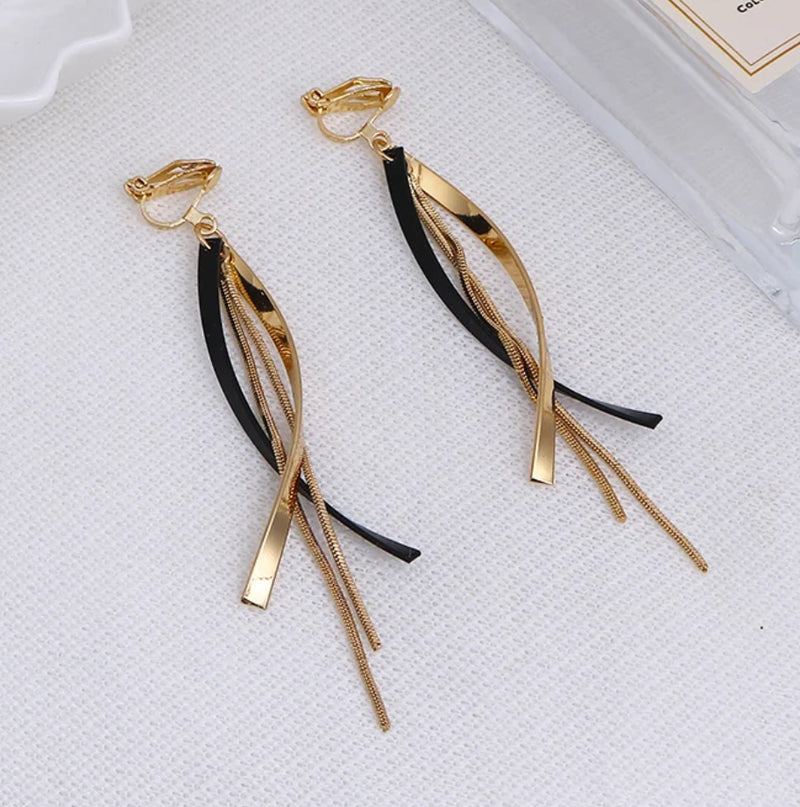 Clip on 4 1/4" long gold and black stone layered black thread earrings
