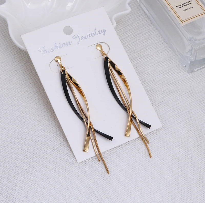 Clip on 3 3/4" long gold and black swirl chain earrings