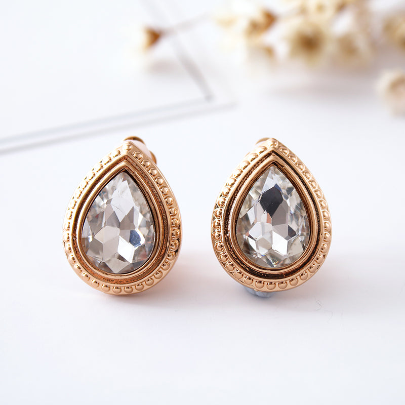 Clip on 1" gold and clear stone button style earrings