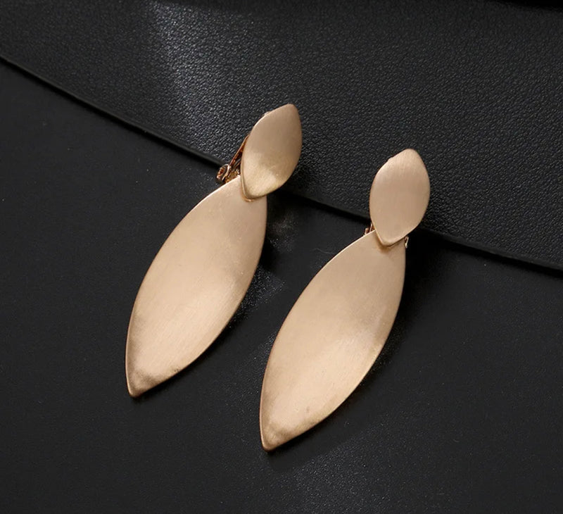Clip on 2 1/4" matte gold pointed dangle earrings