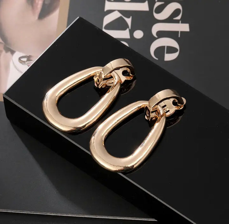 Clip on 1 3/4" shiny gold door knob style dangle earrings
