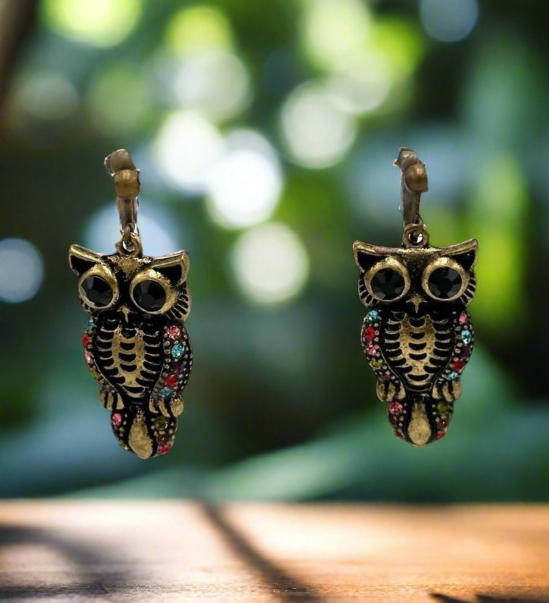 Clip on 1 3/4" brass dangle Owl earrings with multi colored stones