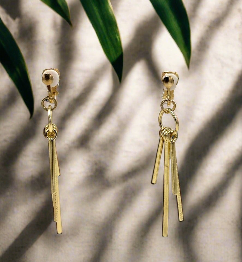 Clip on 2 1/2" textured gold graduated stick earrings