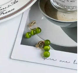 Clip on 1" gold and three green bead button style earrings