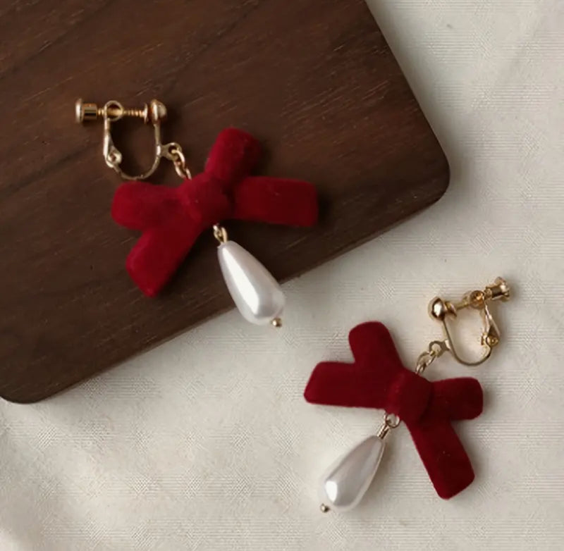 Clip on 2" gold and red velvet bow earrings with dangle pearl