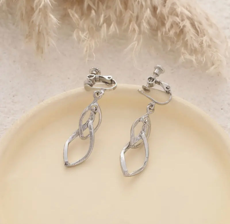 Clip on 1 3/4" silver twisted dangle pointed screw back earrings