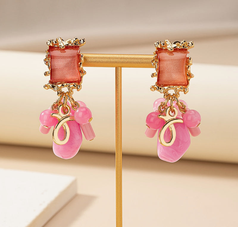 Clip on 2 3/4" gold, pink and peach stone earrings with dangle beads