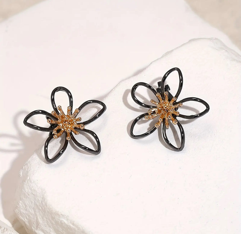 Clip on 1 1/4" gunmetal and old cutout flower button style earrings