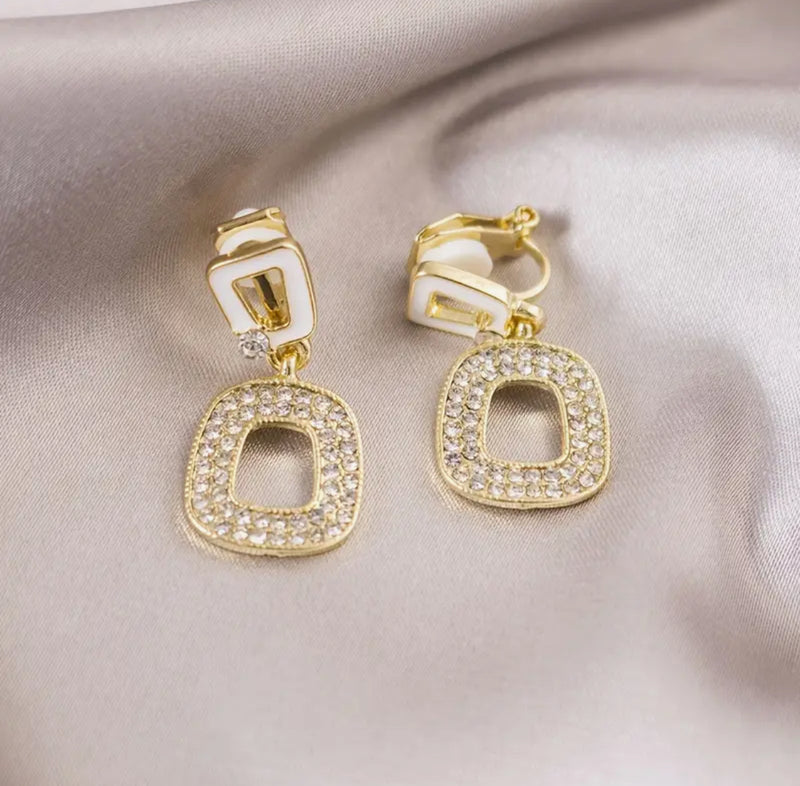 Clip on 1 1/4" gold, white and clear stone dangle square earrings