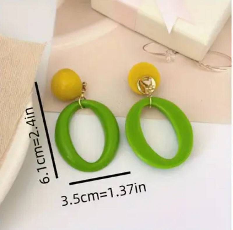 Clip on 2 1/2" gold, yellow and green plastic dangle hoop earrings