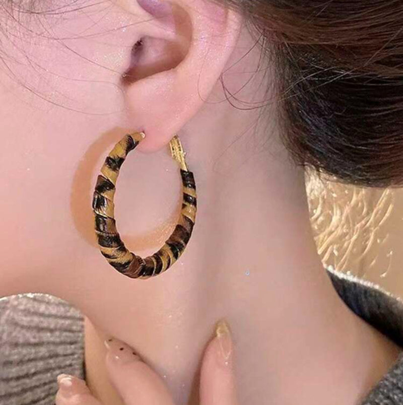 Clip on 2 3/4" gold and brown animal print PU leather hoop earrings