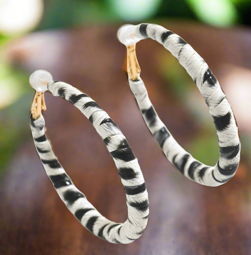 Clip on 2 3/4" gold, black, white animal print PU leather hoop earrings