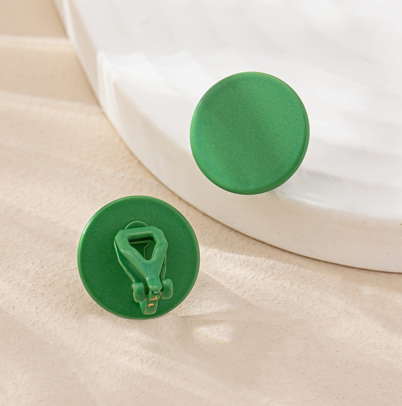 Clip on 3/4" small green flat button style earrings