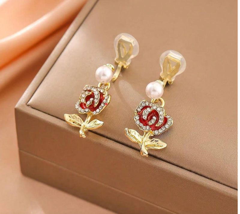 Clip on 1 1/4" gold and red flower earrings w/pearl & clear stones