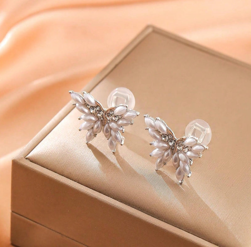 Clip on 3/4" silver, cream pearl and clear stone butterfly earrings