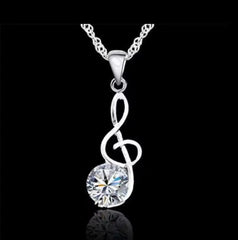 Sterling silver pierced hoop necklace set with music note and clear stone