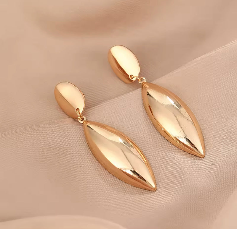 Clip on 3" long shiny gold raised dangle pointed earrings