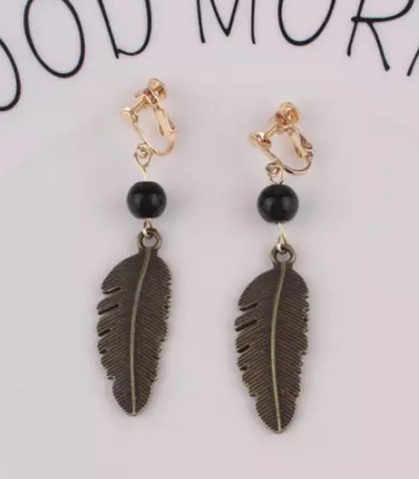 Clip on 2 3/4" brass dangle leaf earrings with black bead