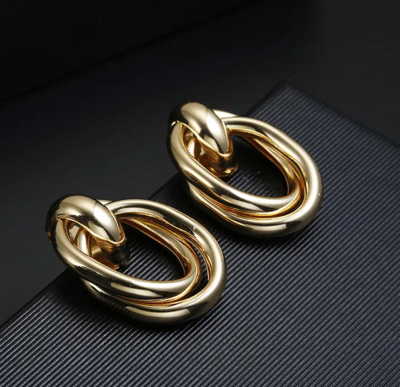 Clip on 1 1/2" shiny gold, rose, silver oval open knot earrings