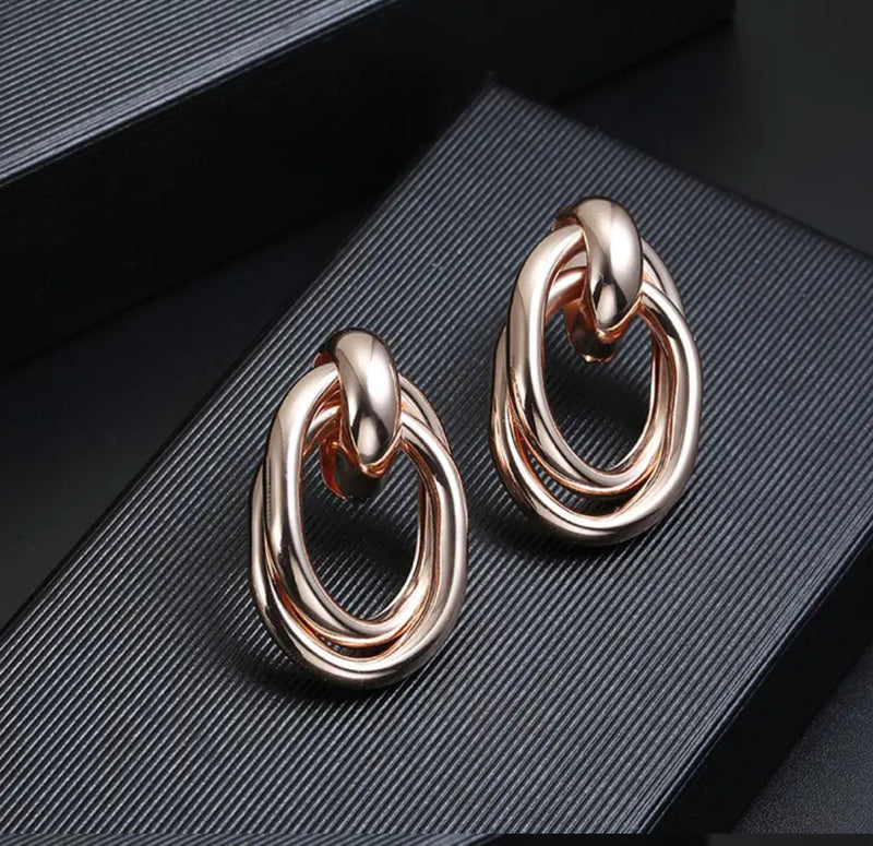 Clip on 1 1/2" shiny gold, rose, silver oval open knot earrings