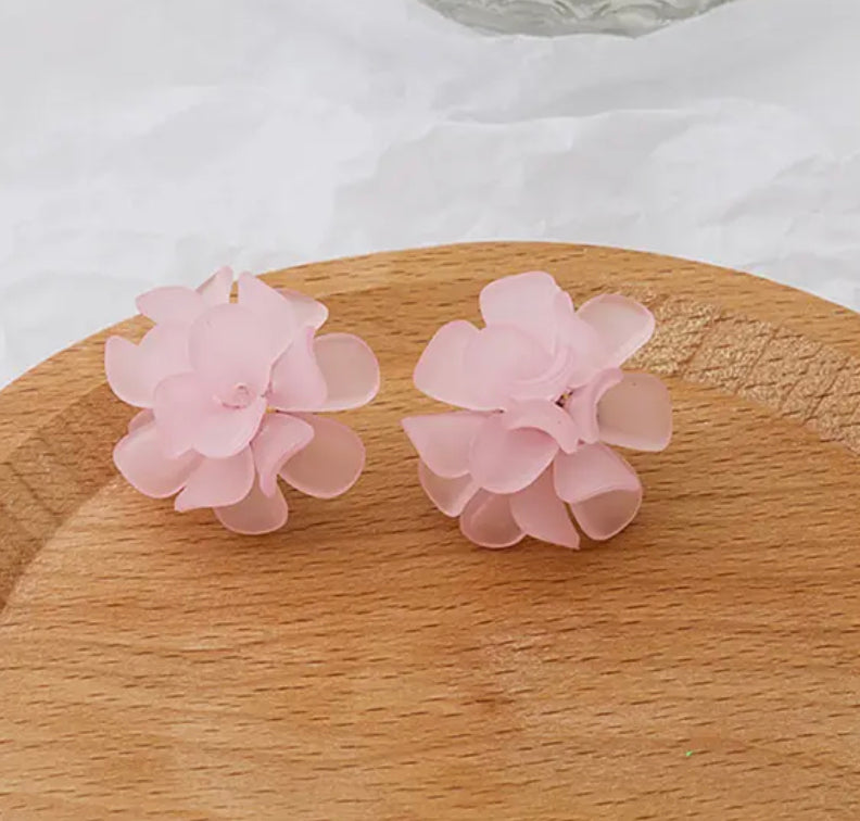 Clip on 1 1/4" gold flower button style earrings in a variety of colors