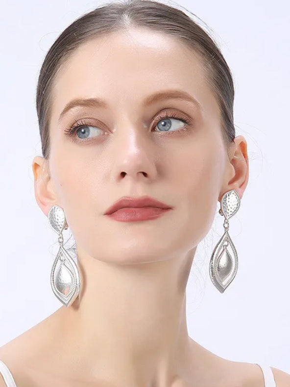 Clip on 3 1/4" matte silver pinhole cutout double teardrop earrings