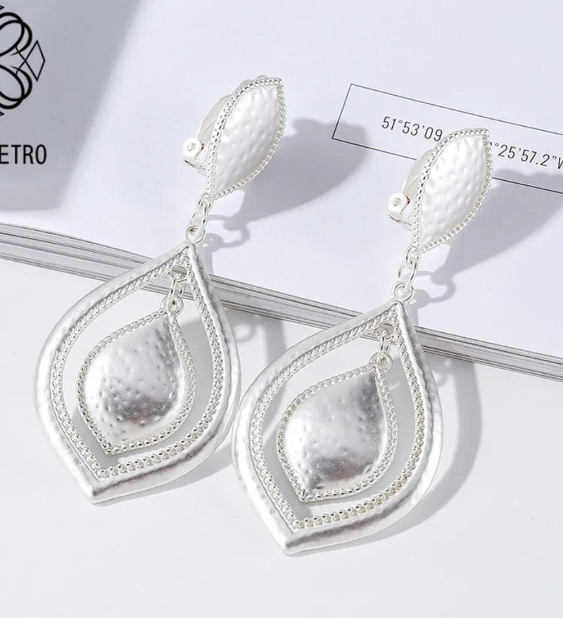Clip on 3 1/4" matte silver pinhole cutout double teardrop earrings