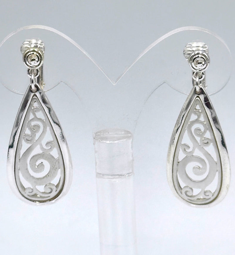 Clip on 1 3/4" matte and shiny silver cutout flower teardrop earrings