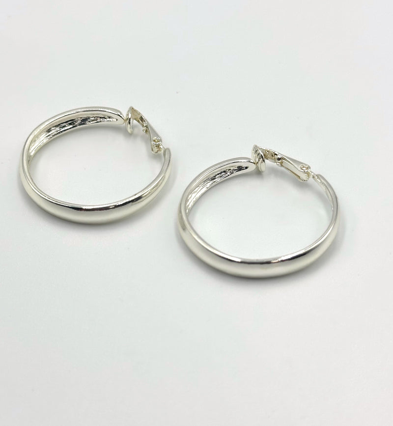 Clip on 1 1/4" shiny silver flat back hoop earrings