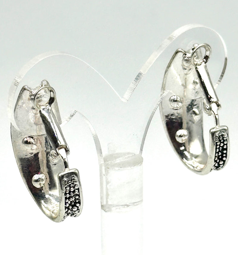 Clip on 1 1/4" silver and black bent earrings w/fluorescent stones