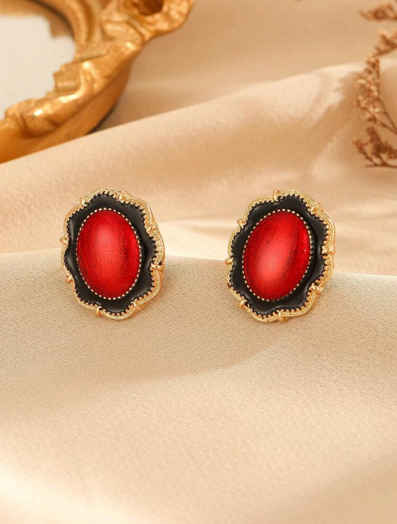 Clip on 1" gold, red and black oval earrings with wavy edges