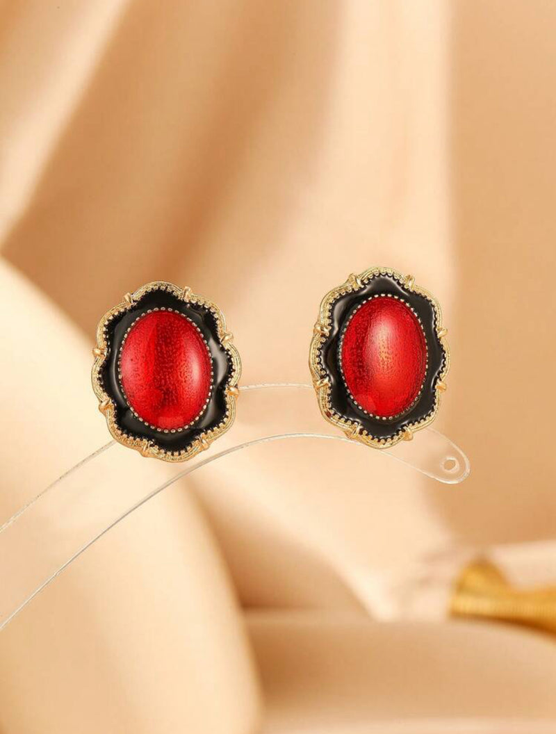 Clip on 1" gold, red and black oval earrings with wavy edges