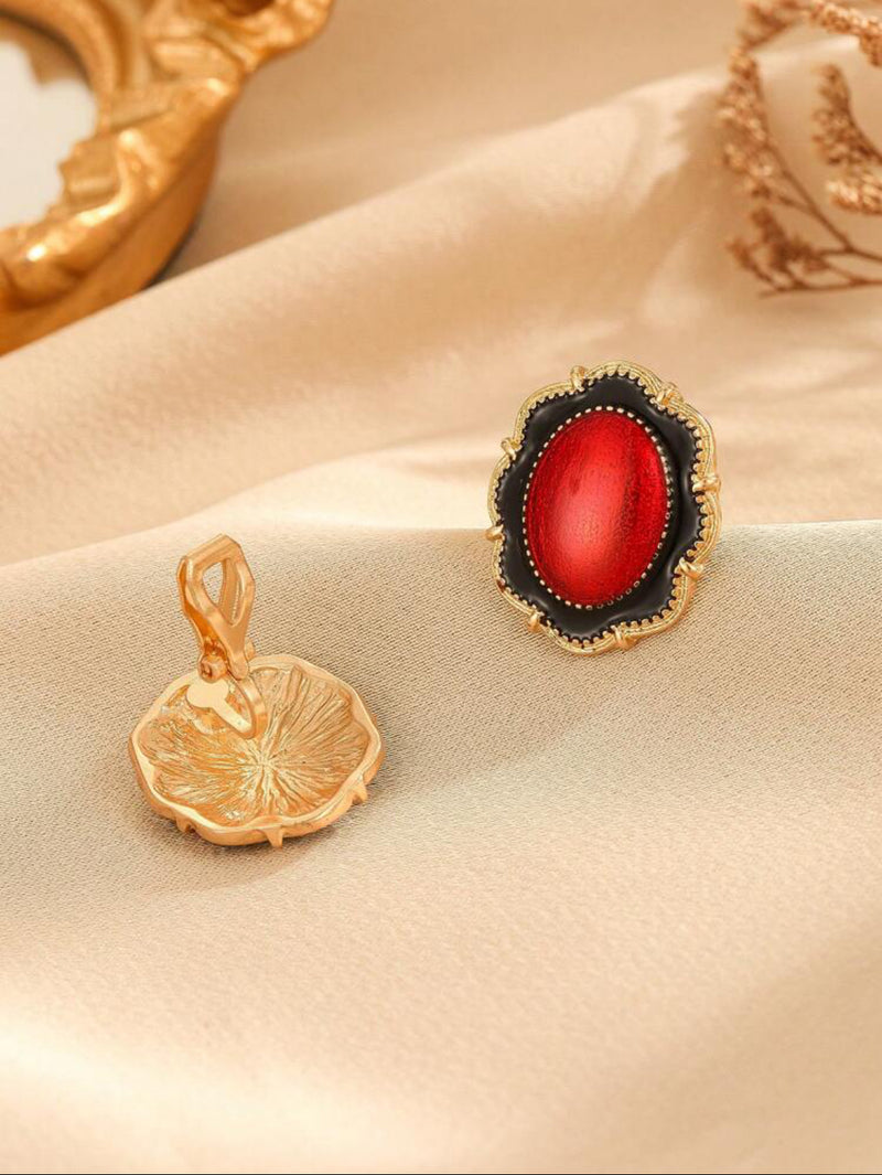 Clip on 1" gold, red and black oval earrings with wavy edges