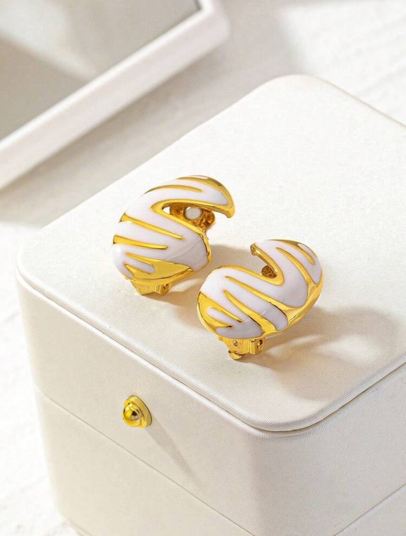 Clip on 1 1/4" gold and white zebra print cutout button style earrings