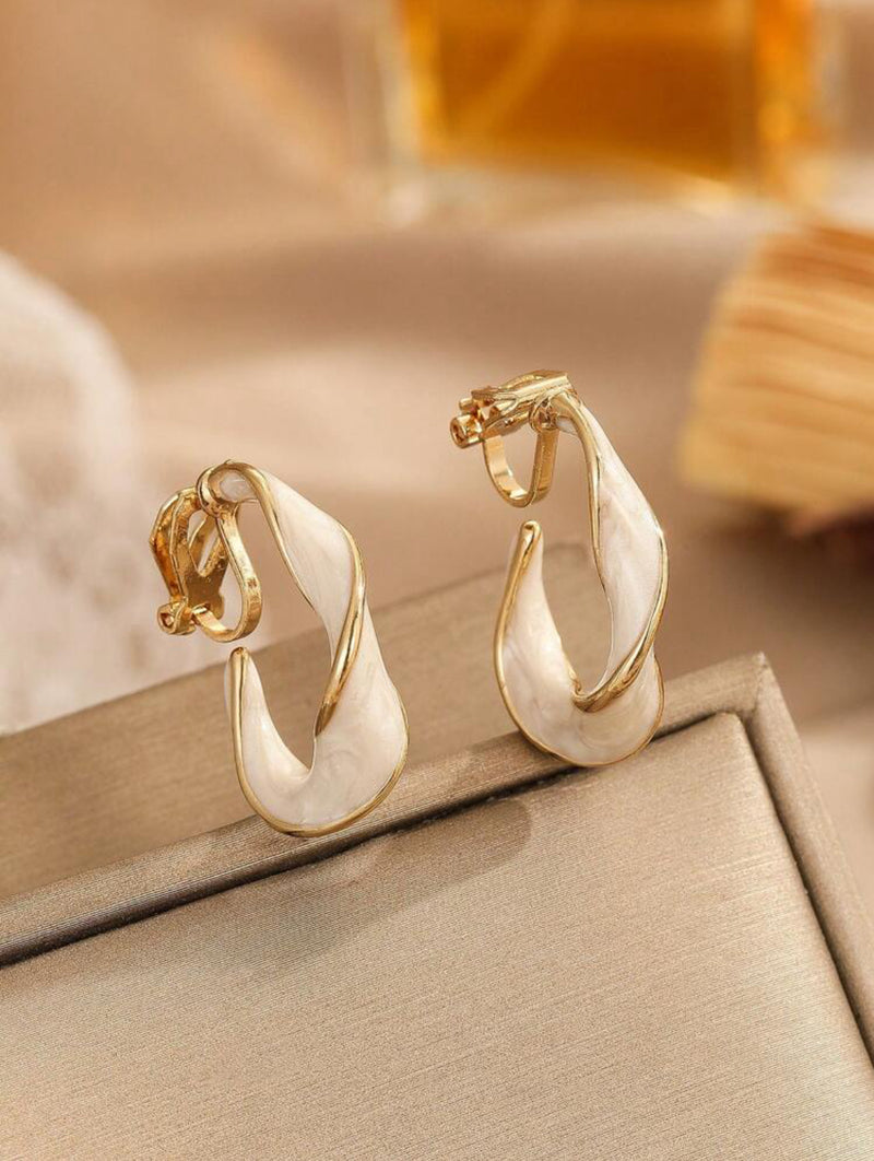 Clip on 1 1/4" gold and white spiral open back hoop earrings