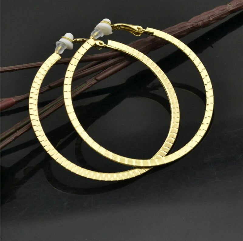 Clip on 2 1/2" gold indented block print hoop earrings
