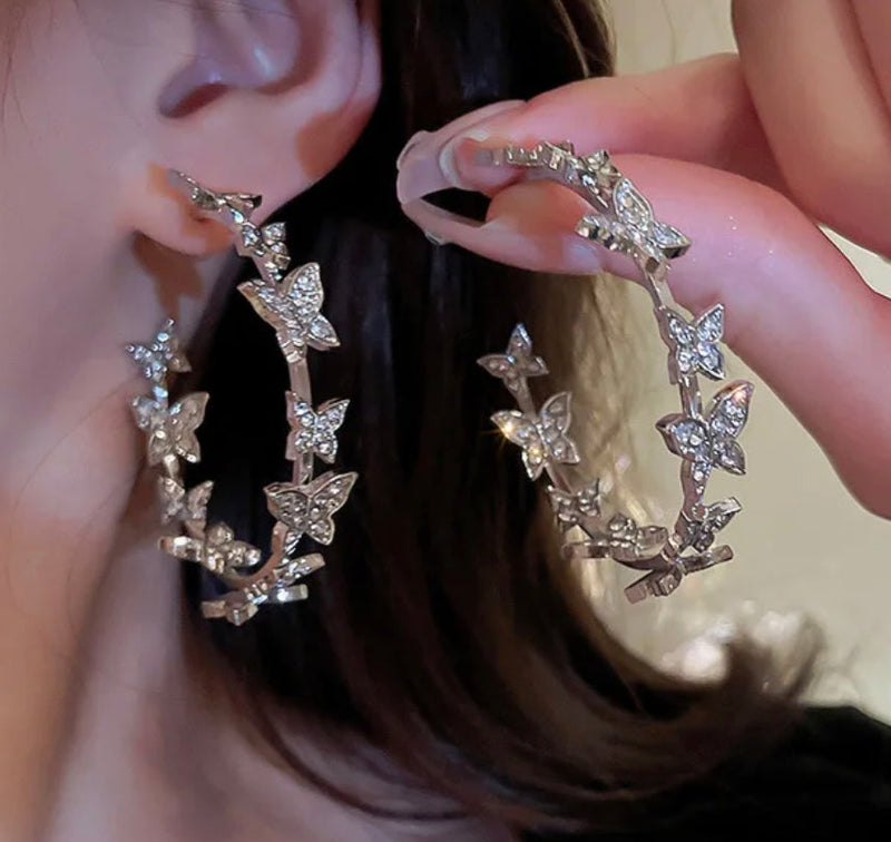 Trendy pierced 2" silver clear stone butterfly open back hoop earrings