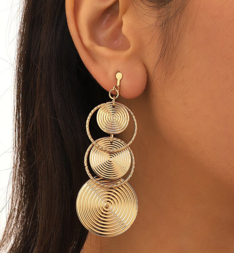 Clip on 3 1/4" long gold textured circle and hoop dangle earrings