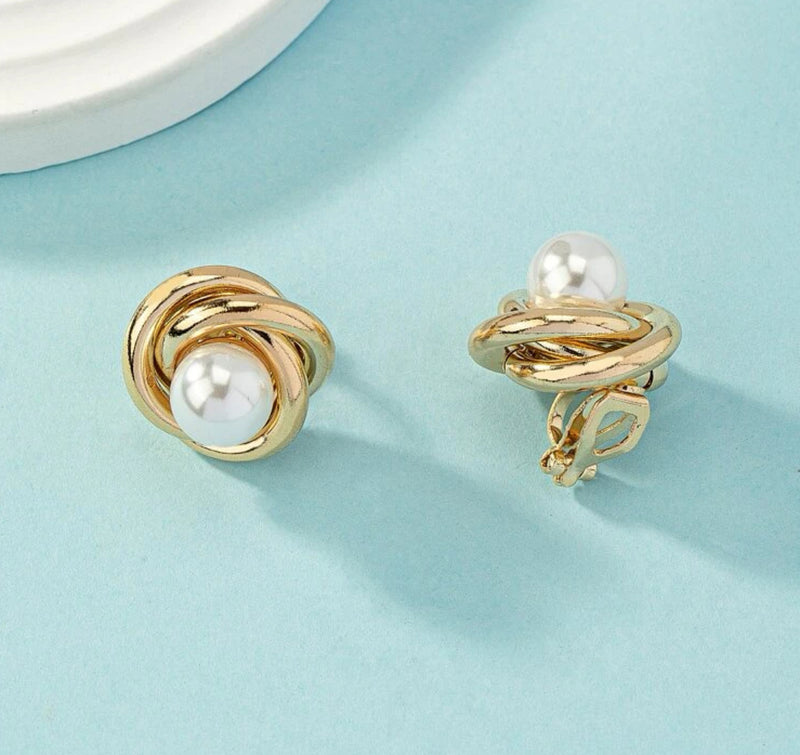 Clip on 3/4" gold knot earrings with center white pearl
