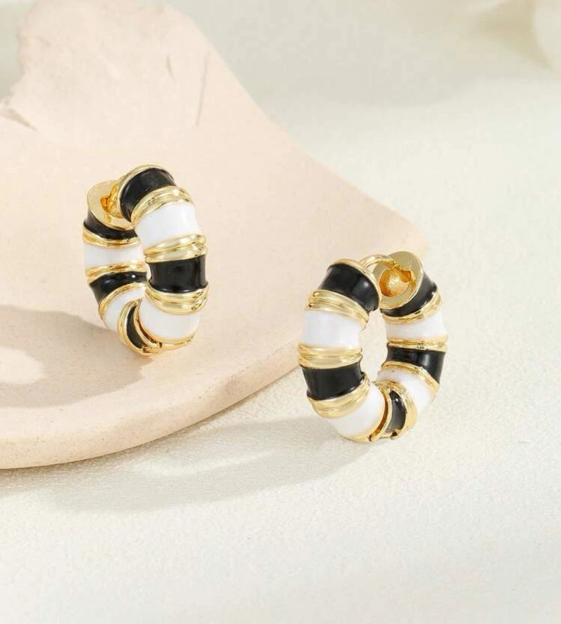 Pierced 3/4" gold, black and white stripe hoop earrings