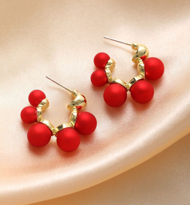 Pierced 1" gold and matte red bead hoop earrings