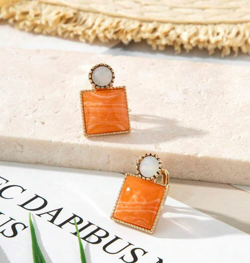 Clip on 3/4" gold, white, orange and white square button style earrings
