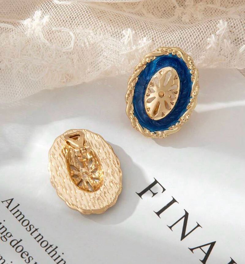 Clip on 1 1/4" gold and blue oval cutout button style earrings