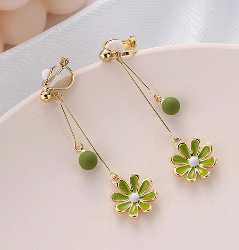 Clip on 2 1/4" gold wire earrings with dangle green bead and flower