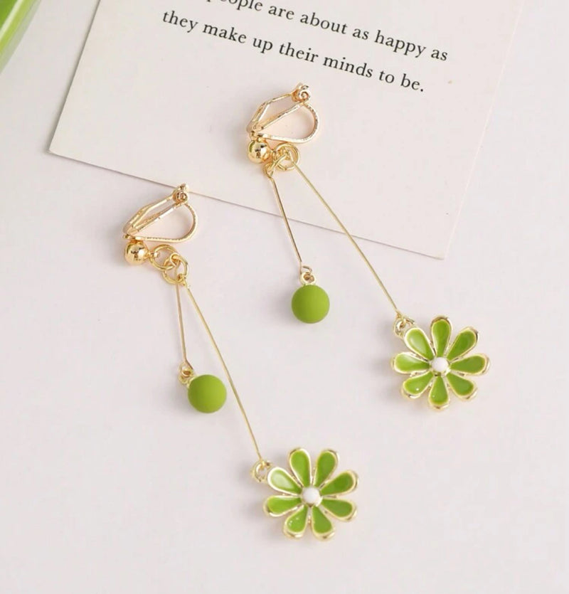 Clip on 2 1/4" gold wire earrings with dangle green bead and flower