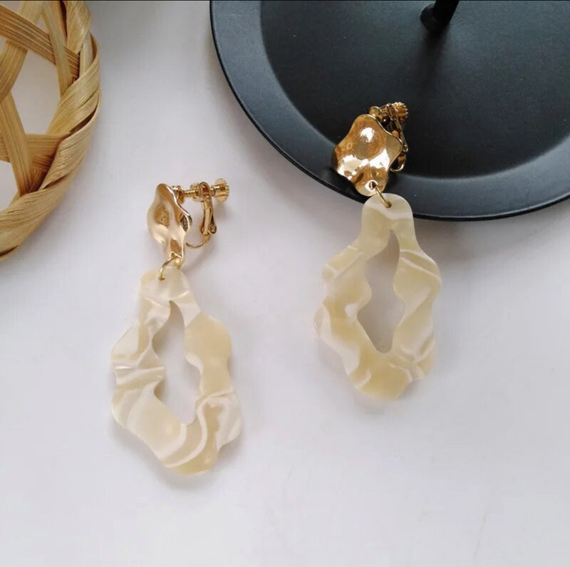 Clip on 2 1/2" gold and cream odd shaped dangle earrings