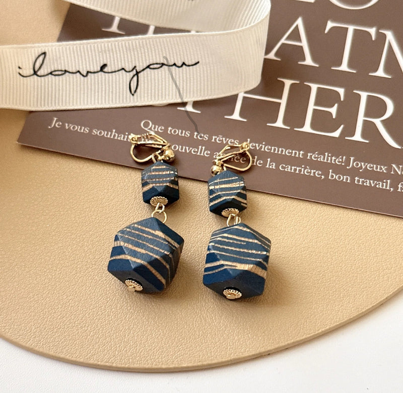 Clip on 2 1/4" gold, blue and brown wood stripe bead dangle earrings
