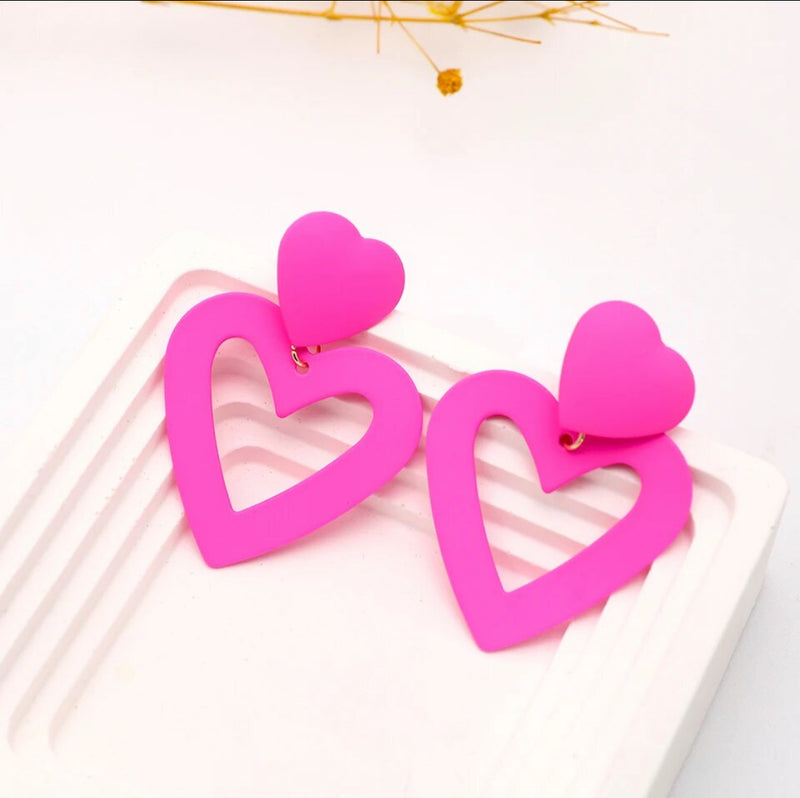 Clip on 2 1/4" pink double cutout dangle metal heart earrings